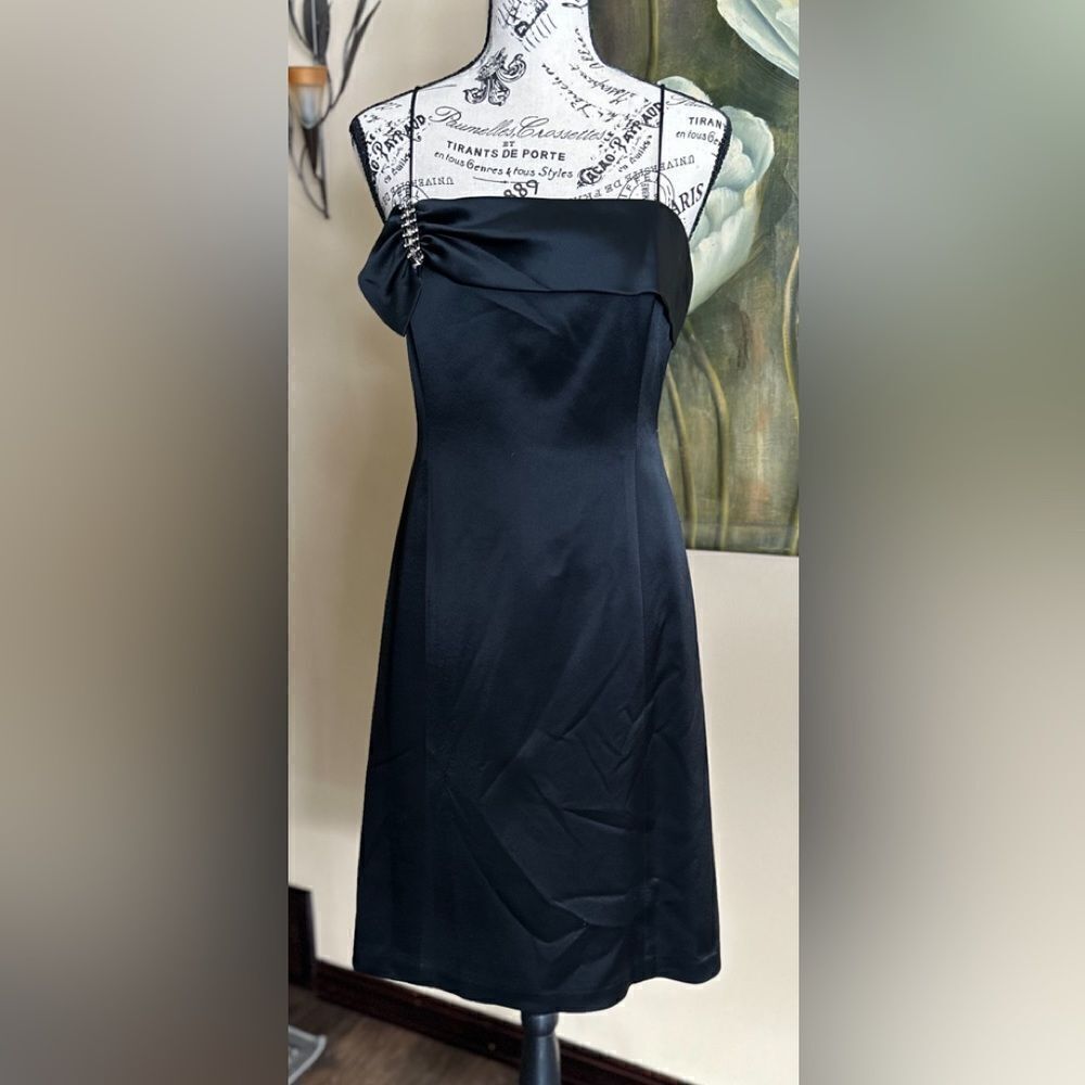 Anne Klein Little Black Dress with spaghetti straps . Feels like silk .Size 4.